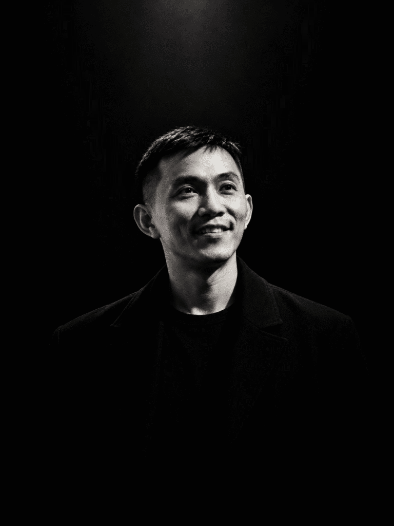 Hans Kristo, Indonesian artist, in a dramatic black-and-white cinematic portrait