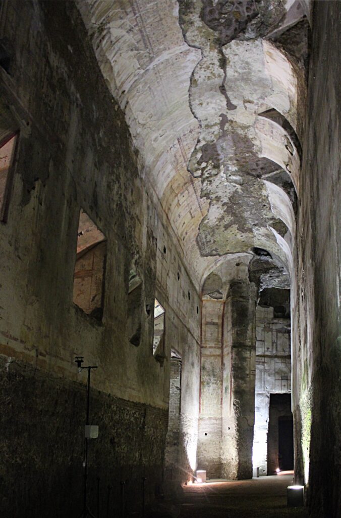 Vaulted corridor inside Nero’s Domus Aurea in Rome, showing ancient wall paintings that inspired the grotesque style.