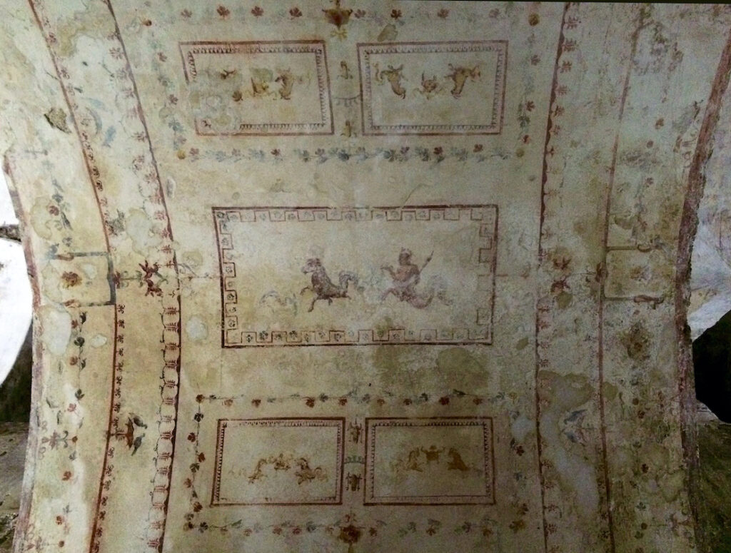 Ceiling fresco detail from Nero’s Domus Aurea in Rome, showing mythological figures, floral motifs, and ornamental patterns that inspired grotesque art.