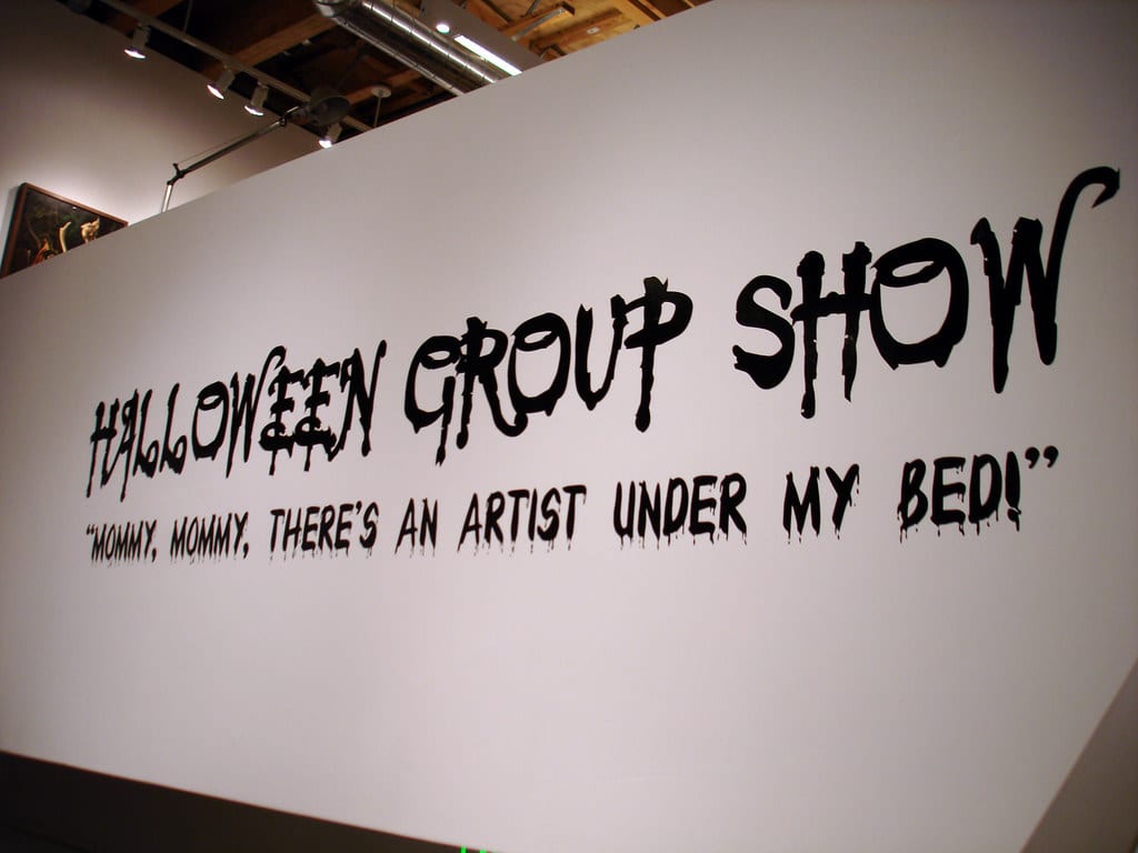 Corey Helford Gallery Halloween group show title wall reading Mommy Mommy There's An Artist Under My Bed in Los Angeles.