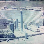 8 Captivating and Powerful Reasons Young Art Collectors Are Transforming the Art World — From Pop Surrealism to AI Art 16 Alexandria Roman amphitheater ruins with semicircular stone seating, illustrating the architectural foundations of Hellenistic art and style.